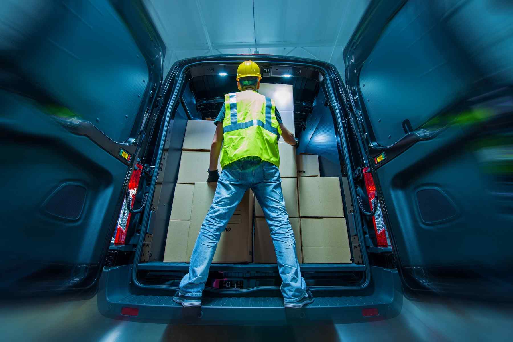 Courier worker loading parcels